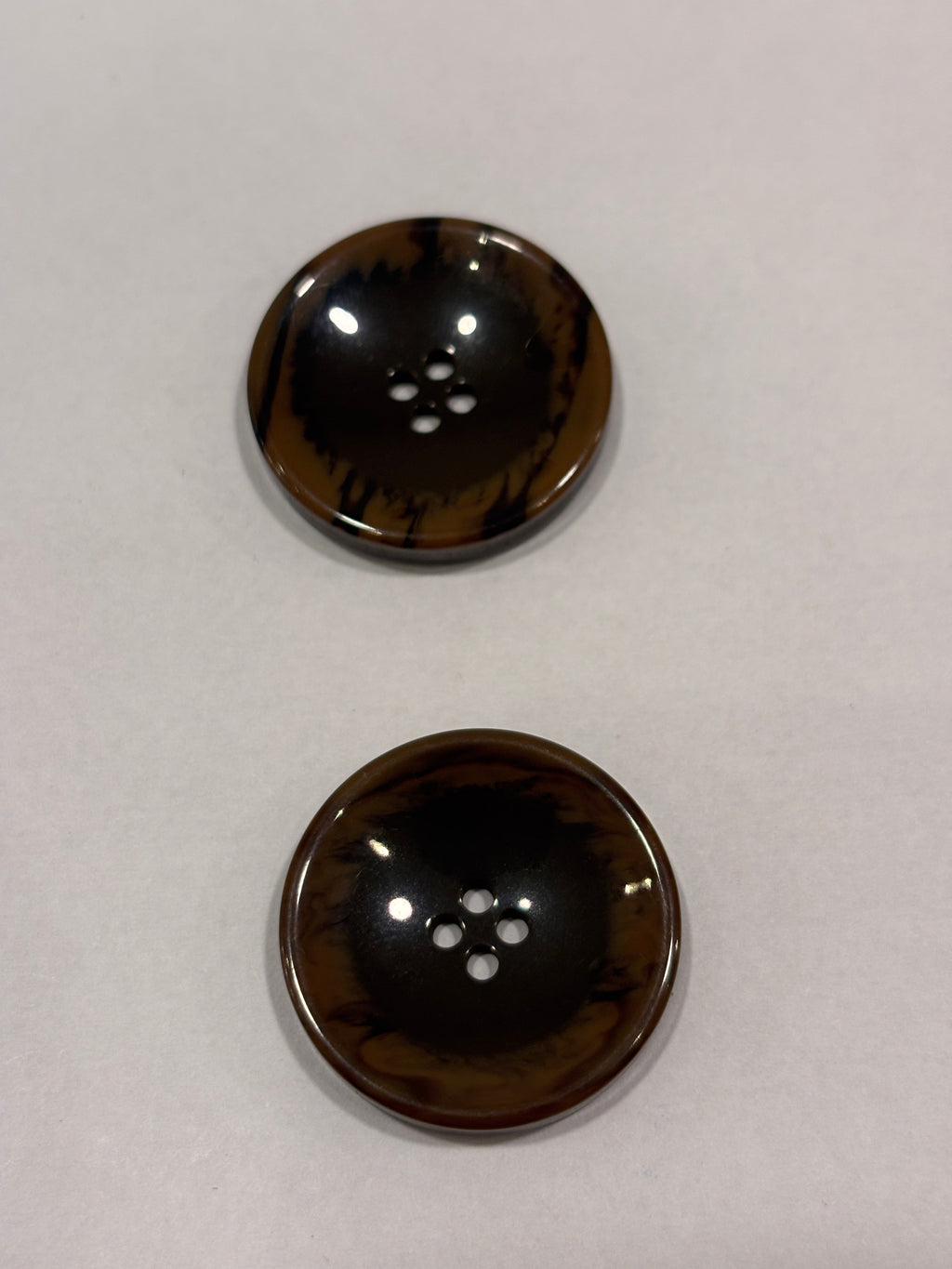 Button P5555 - 25mm (40") polyester button in dark brown with four holes, perfect for sewing and crafting. boton