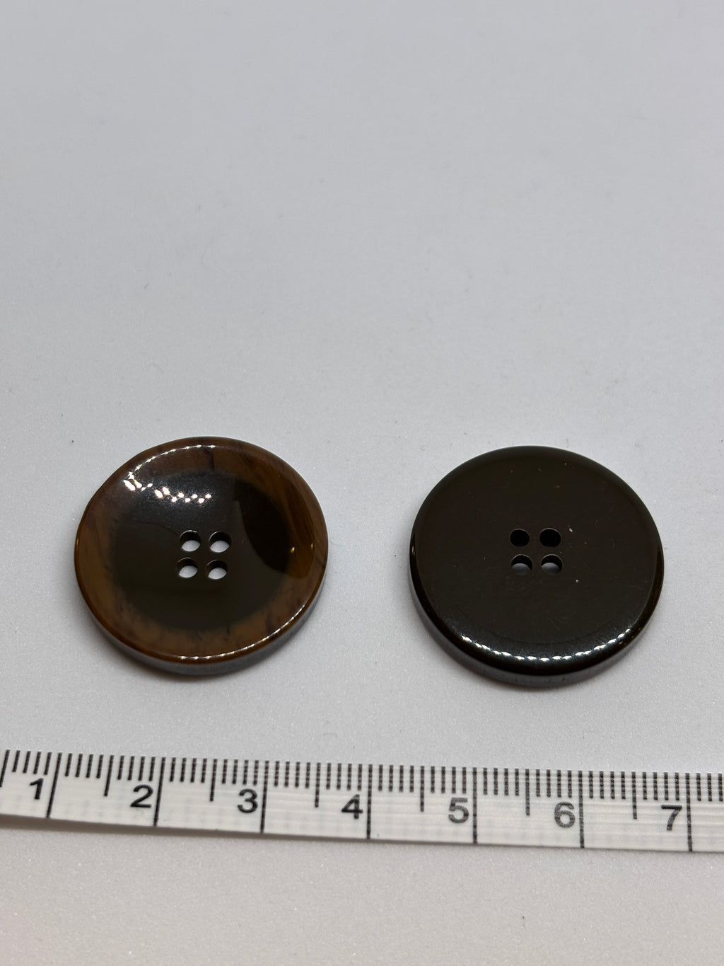 Button P5555 - 25mm (40") polyester button in dark brown with four holes, perfect for sewing and crafting. boton