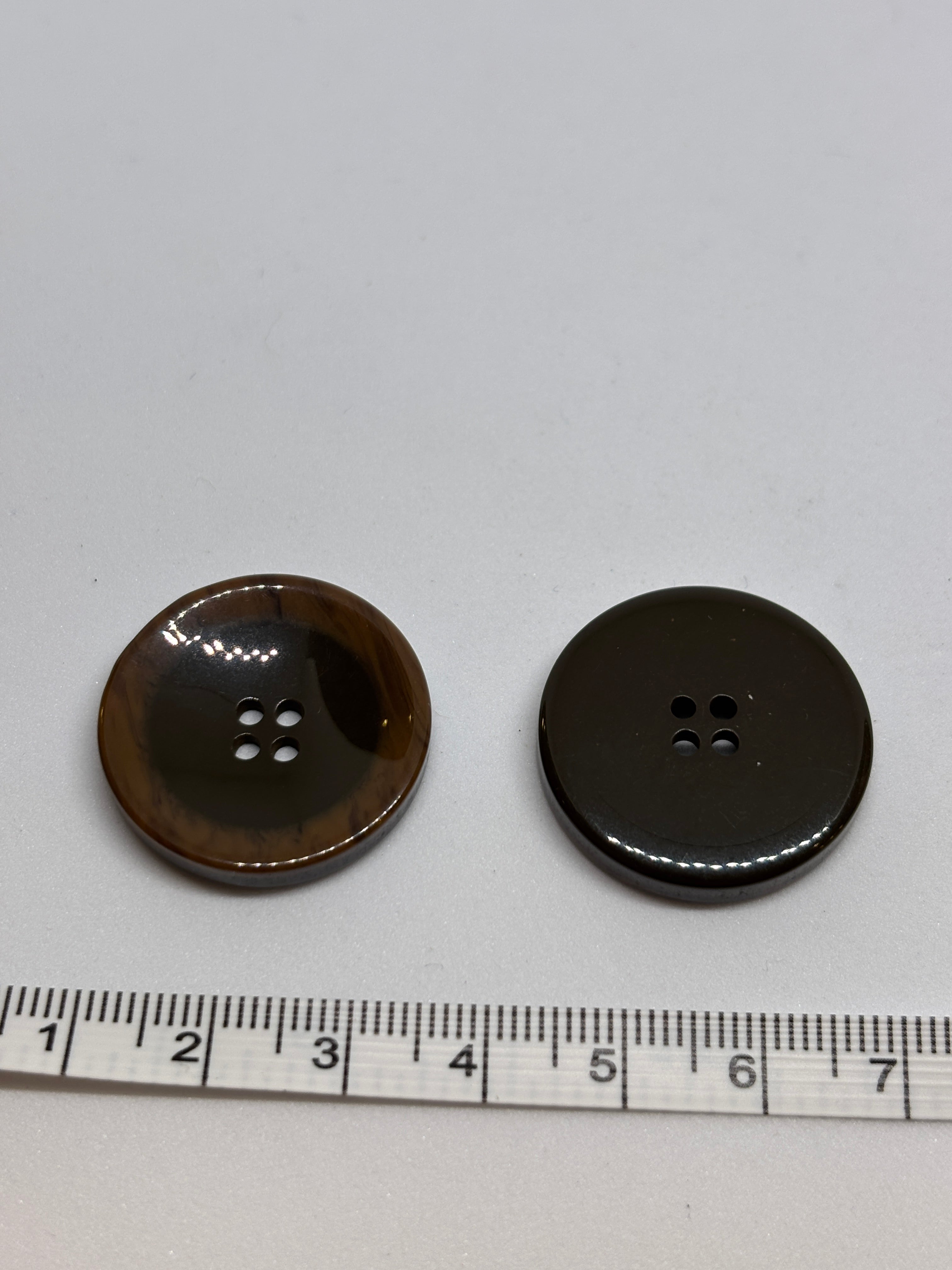 Button P5555 - 25mm (40") polyester button in dark brown with four holes, perfect for sewing and crafting. boton