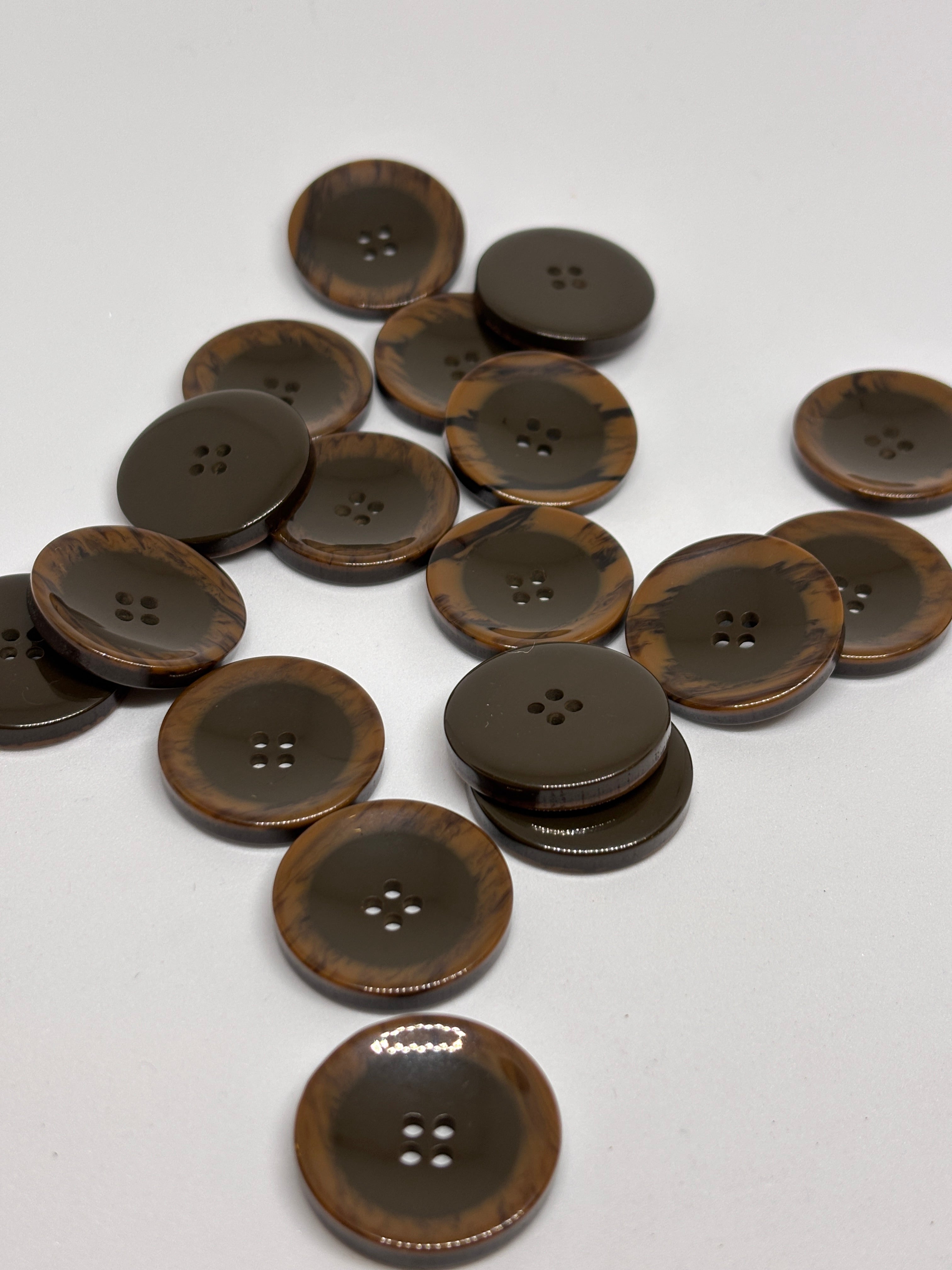 Button P5555 - 25mm (40") polyester button in dark brown with four holes, perfect for sewing and crafting. boton