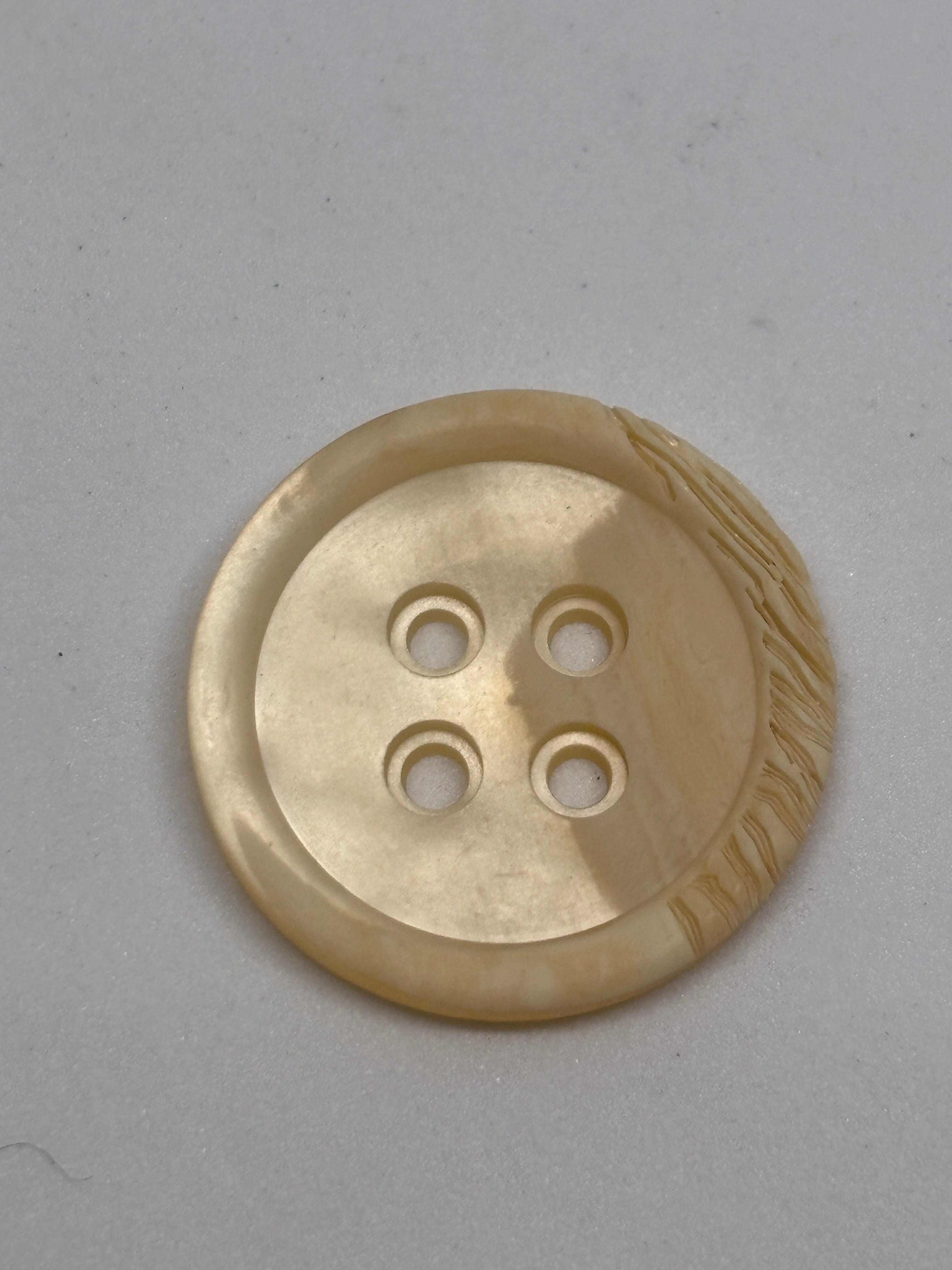 Polyester button P54299 - 36" in off-white color, featuring four holes for sewing and crafting. Boton