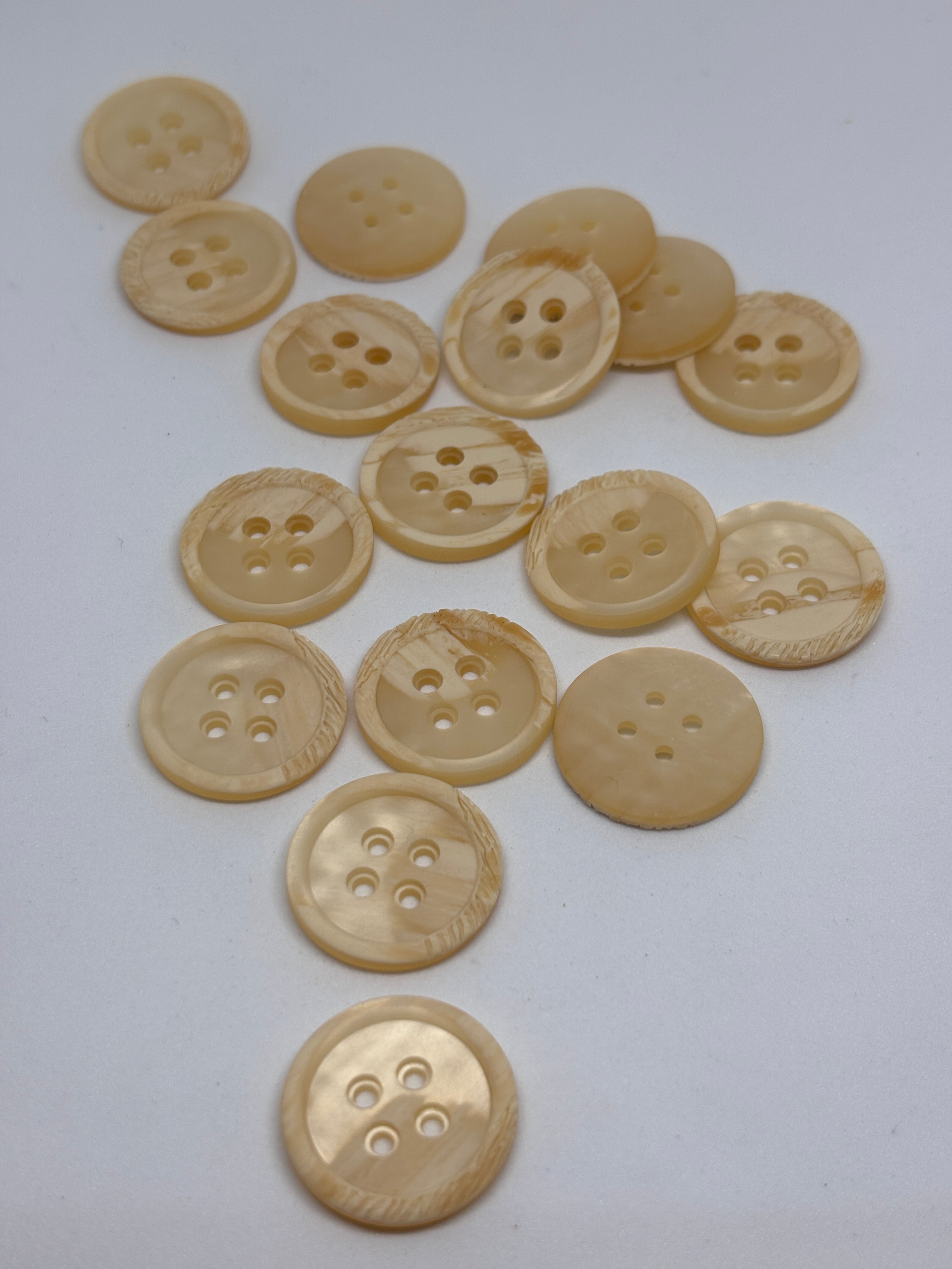 Polyester button P54299 - 36" in off-white color, featuring four holes for sewing and crafting. Boton