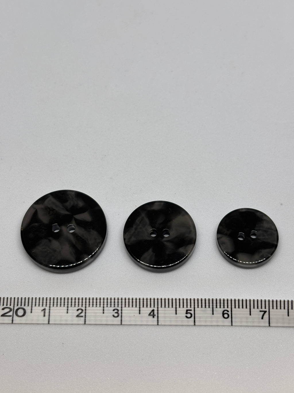 Button 2025 Black, 18mm, 22mm, 25mm polyester button with 2 holes. Boton