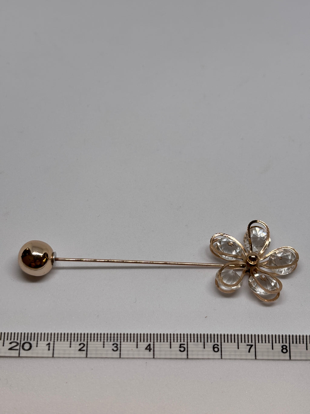 Brooch C 1472 featuring a flower design with crystal petals and a shiny ball end, elegant brooch for any occasion. broche